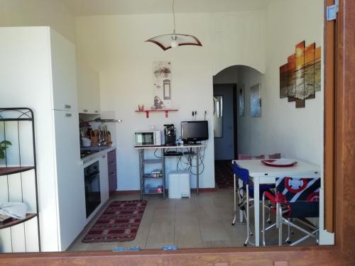 Kuchyň nebo kuchyňský kout v ubytování Apartment The Sea of Sardinia