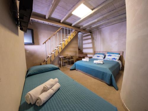 A bed or beds in a room at Casa della Palma