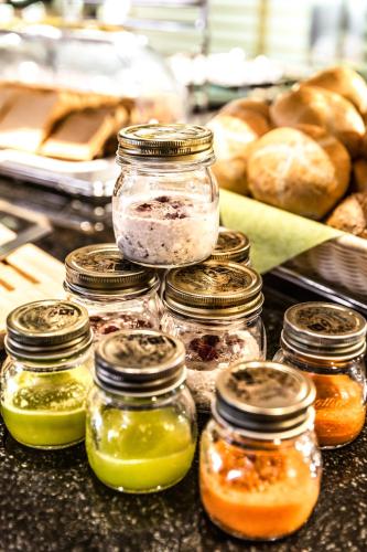 a group of jars filled with different types of condiments at TUI BLUE Schladming in Schladming