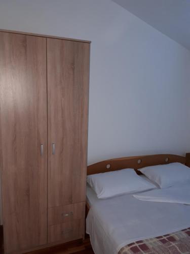 A bed or beds in a room at Apartments Horvat on Island Pag