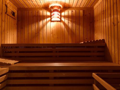 an empty sauna with a light on the wall at Rafael Kaiser Residence Privée - Spielberg Obdach in Obdach