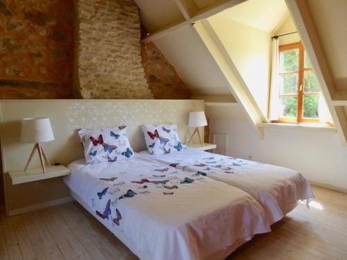 Postel nebo postele na pokoji v ubytování Chambres d'Hotes à La Chandelle