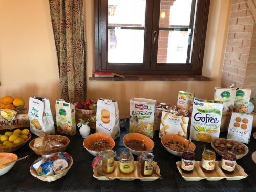 a table topped with lots of different kinds of food at Agriturismo Il Felciaione in Massa Marittima