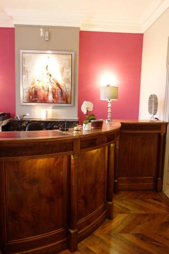 a kitchen with a large painting on the wall at Domaine de Clairefontaine - Teritoria in Chonas-lʼAmballan