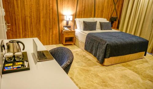 Postel nebo postele na pokoji v ubytování Extenso Hotel