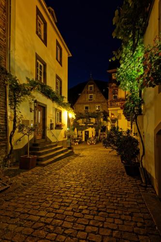 a cobblestone street in an old town at night at Villa Beilstein in Beilstein