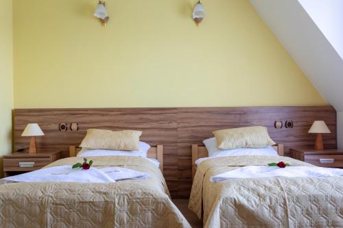 Ένα ή περισσότερα κρεβάτια σε δωμάτιο στο Hotel Góralski Raj