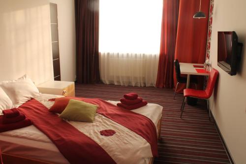 Postel nebo postele na pokoji v ubytování Hotel Kalyna