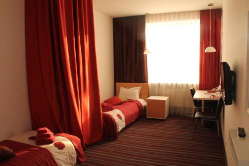 Postel nebo postele na pokoji v ubytování Hotel Kalyna