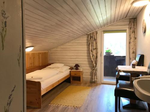 מיטה או מיטות בחדר ב-Panoramahaus