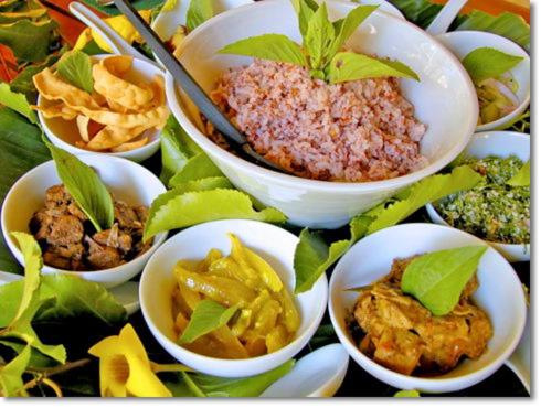 a bunch of bowls of food on a table at Lake Near in Tissamaharama