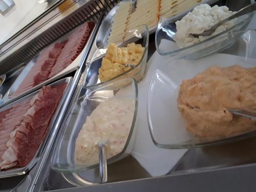 a display case filled with different types of food at Pension Joseph Haydn in Podersdorf am See