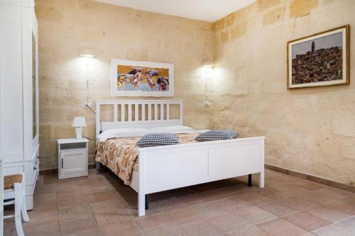 Säng eller sängar i ett rum på La Locanda di Zì Nicola