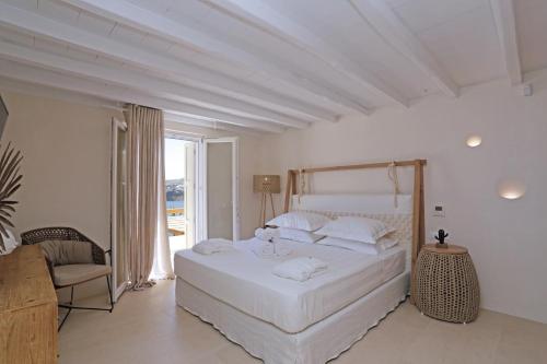 Postel nebo postele na pokoji v ubytování Villa Veneta Mykonos