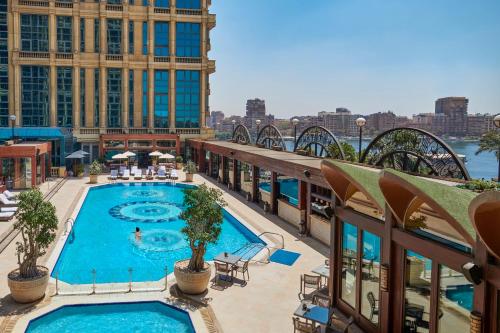 a view of a building with a swimming pool at Four Seasons Cairo At The First Residence in Cairo