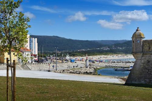 a view of a beach with people on the water at Angelas - Casa Da Eira in Vila Praia de Âncora