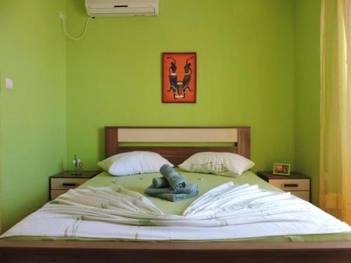 Postel nebo postele na pokoji v ubytování Apartment GREEN Jelsa