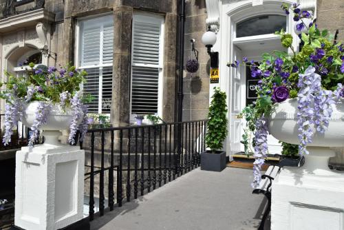 a house with flowers on the front of it at Edinburgh37 in Edinburgh