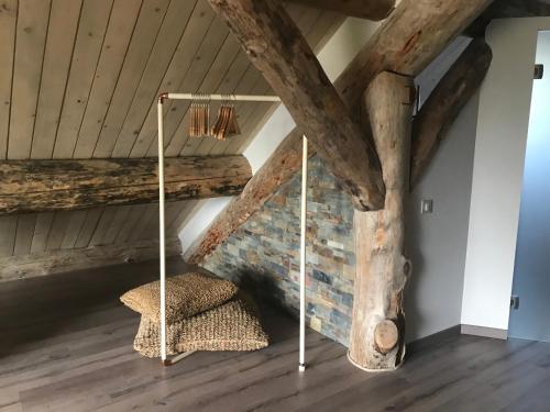 a room with a bed in a attic at Le Chalet de Lyne in Erckartswiller