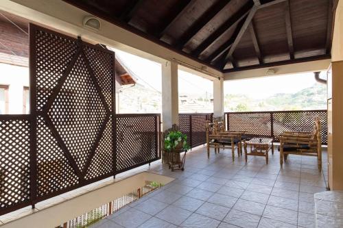 a screened in porch with a table and chairs at Old Town House in Sarajevo in Sarajevo
