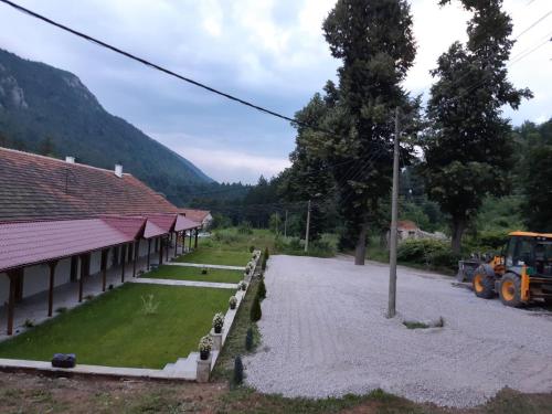 a tractor is parked in front of a building at Apartmani Gmitrovic in Rtanj