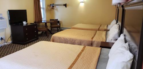 Cama o camas de una habitación en Budget Inn