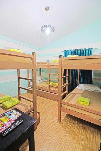 a room with two bunk beds and a table at Caliraya Resort Club in Lumban
