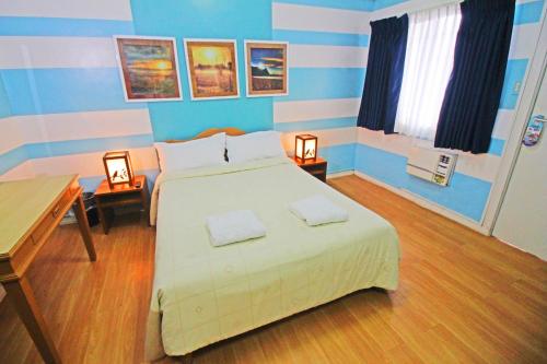 Posteľ alebo postele v izbe v ubytovaní Caliraya Resort Club