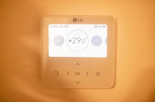an electronic device with a clock on it at One Way Guesthouse Busan in Busan