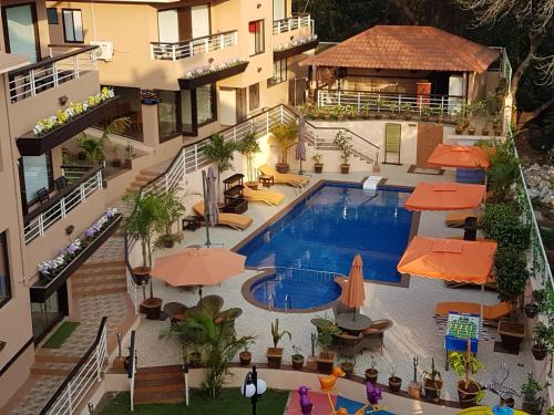 an aerial view of a hotel with a swimming pool at La Sunila Suites & Villas by WSI, Baga in Baga