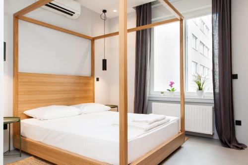 Krevet ili kreveti u jedinici u okviru objekta Rooms and Apartments Glossy