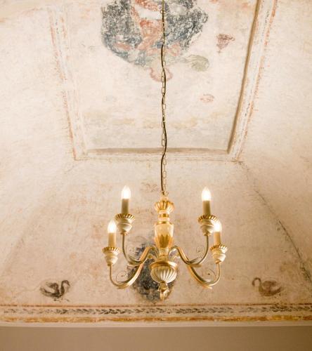 a chandelier hanging from a ceiling at B&B San Trifone in Adelfia