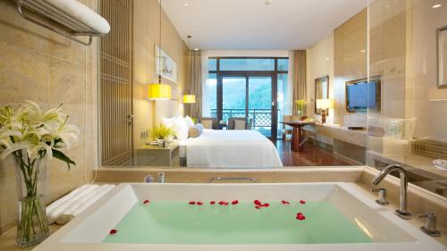A bed or beds in a room at Dahongpao Resort