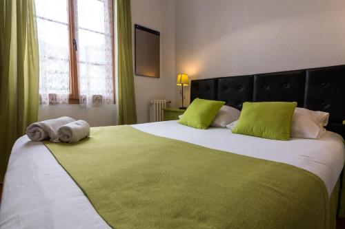 Katil atau katil-katil dalam bilik di Ma Petite Auberge