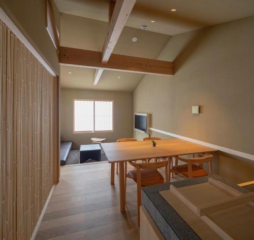a dining room with a table and chairs at Campton Kiyomizu Vacation Rental in Kyoto