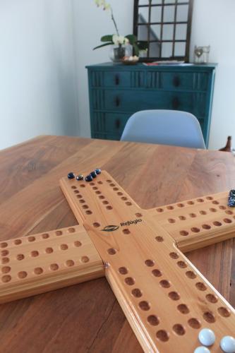 two wooden dominoes sitting on top of a table at Refúgio in Horta