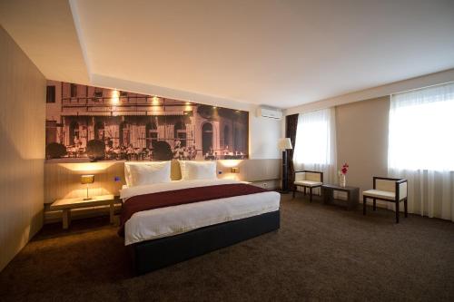 Postel nebo postele na pokoji v ubytování City Hotel Mostar