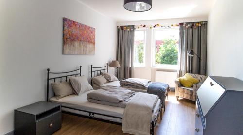 Posteľ alebo postele v izbe v ubytovaní A+ apartament Rajska