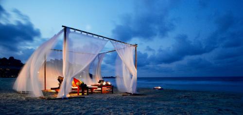 a tent on the beach at night at Cassia Bintan, part of Banyan Group in Lagoi