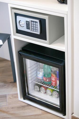 a microwave oven sitting inside of a small refrigerator at Viria B&B Sorrento in Sorrento
