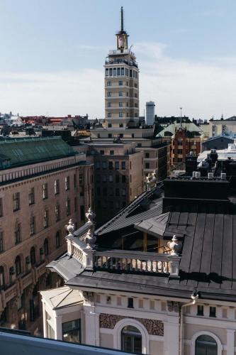 a view of a city with a tall building at Hotel St. George Helsinki in Helsinki