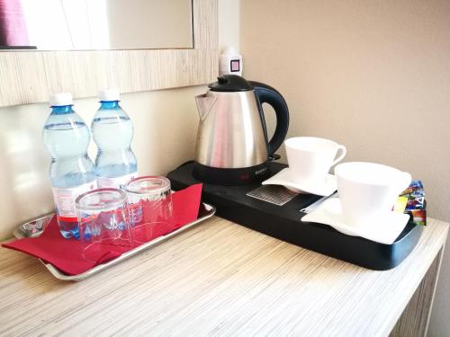 Coffee and tea making facilities at Ośrodek Wczasowy Paradise