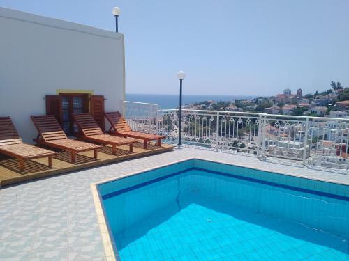 a swimming pool on the roof of a building at Κastro Ηotel in Agios Kirykos