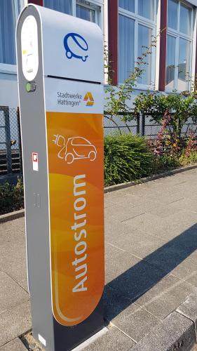 a sign on the side of a street with avertisement at Ruhr Inn Hotel in Hattingen