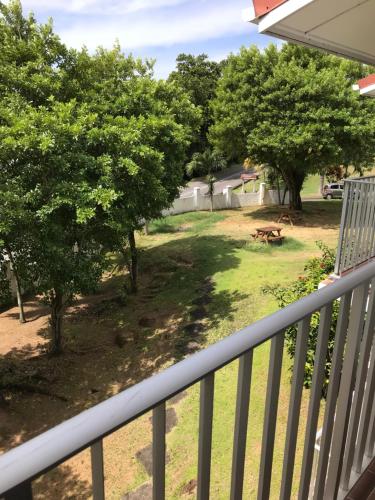 a view of a yard from the balcony of a house at Michel Holiday Apartments in Victoria