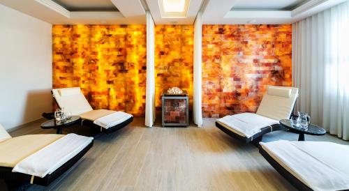 a room with two beds and a brick wall at Airport Hotel Okęcie in Warsaw