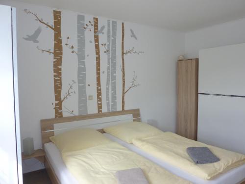 En eller flere senge i et værelse på Ferienwohnung Edelmann