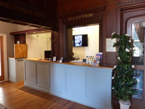 The lobby or reception area at Farnham House Hotel 