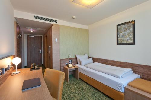 מיטה או מיטות בחדר ב-Hotel Bildungsblick