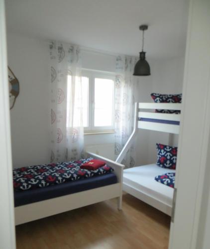 Ein Bett oder Betten in einem Zimmer der Unterkunft Ferienwohnung BELVEDERE